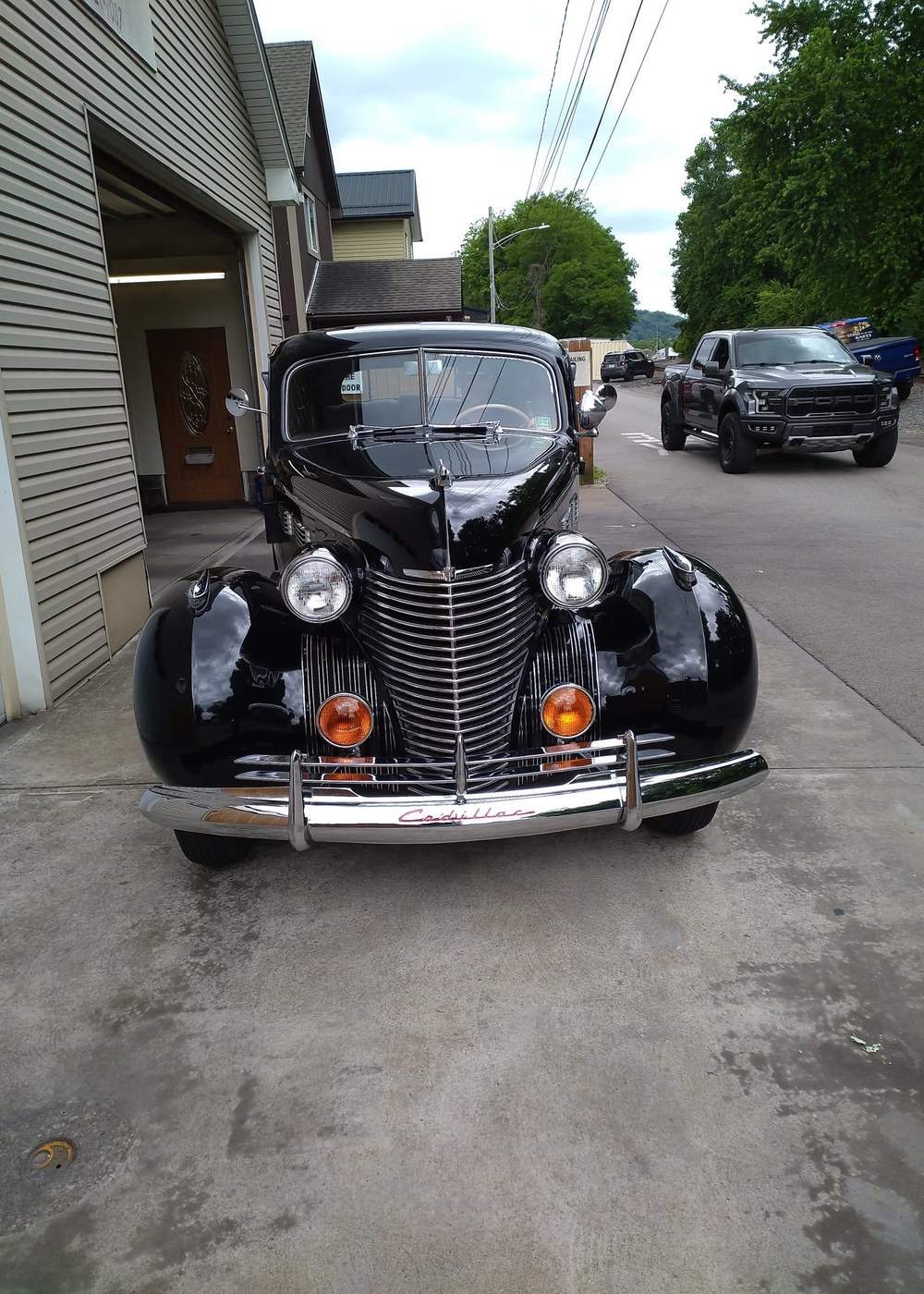 Classic black Cadillac with a high-gloss detailed finish