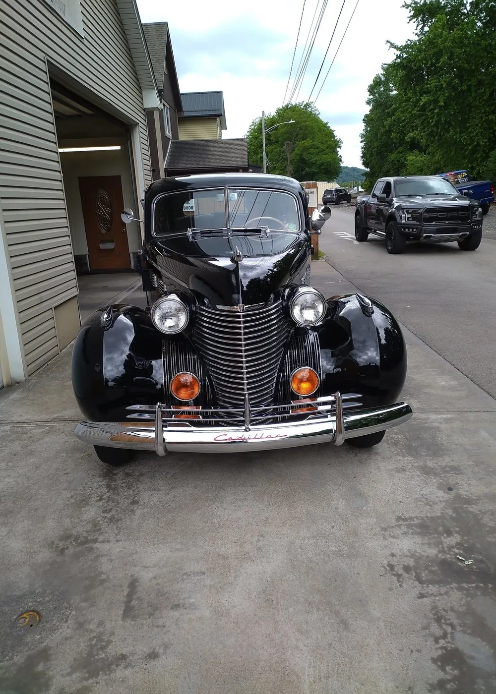 Classic black Cadillac with a high-gloss exterior detail by Mike's Custom Detailing