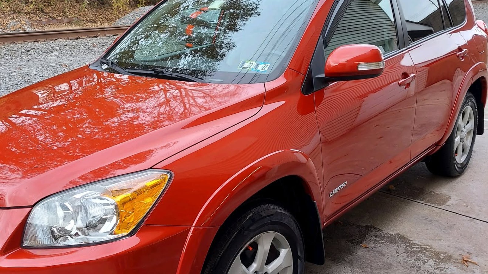 Freshly detailed red SUV with a glossy exterior finish